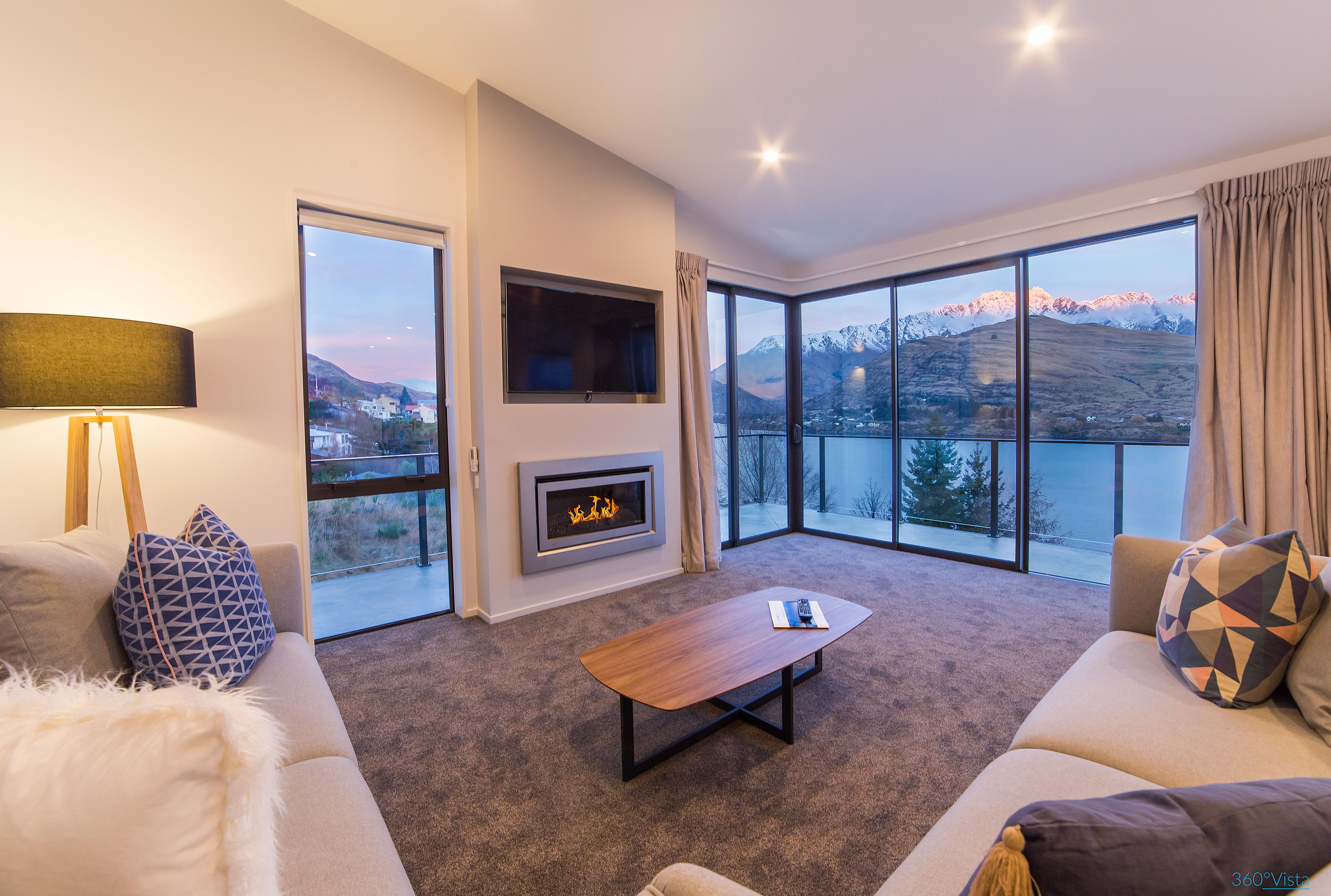 Luxurious living room with cozy fireplace and stunning mountain views