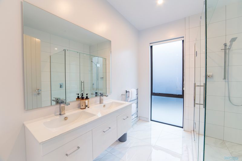 Luxury master bedroom ensuite bathroom with premium fixtures